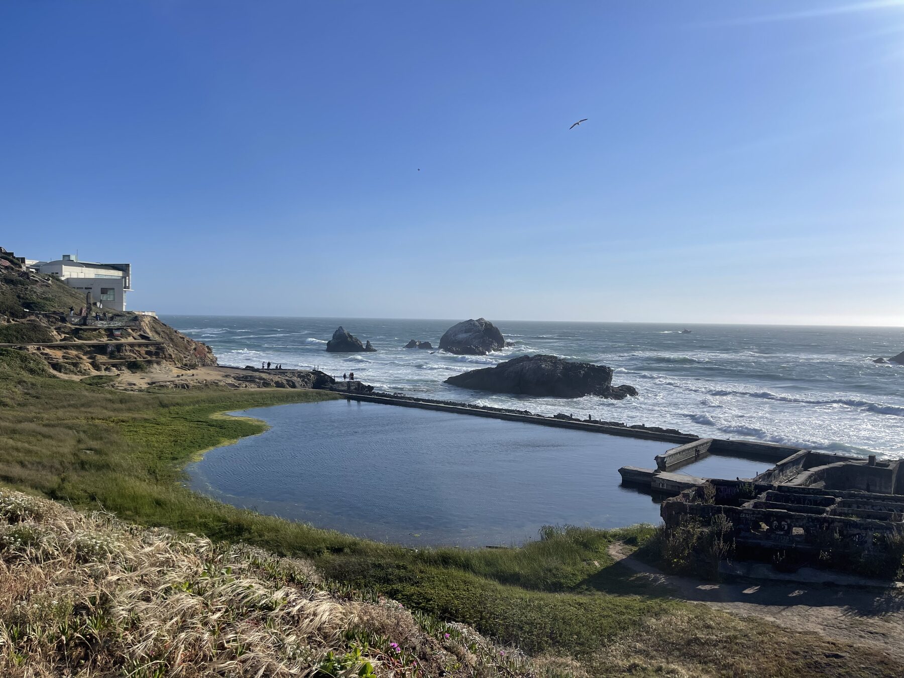 The Sutro Baths pools beside the ocean.