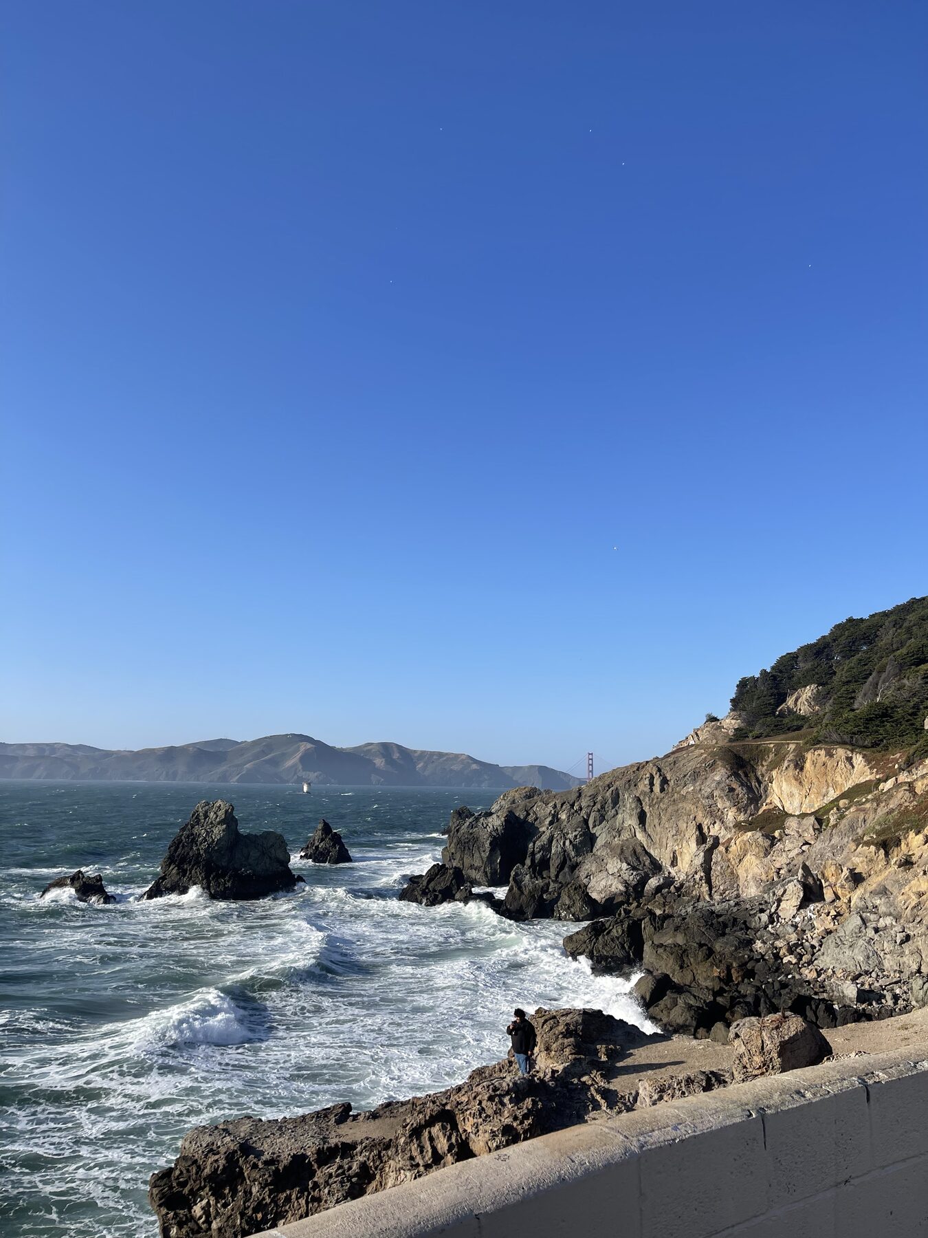 Waves breaking below the coastal cliffs.