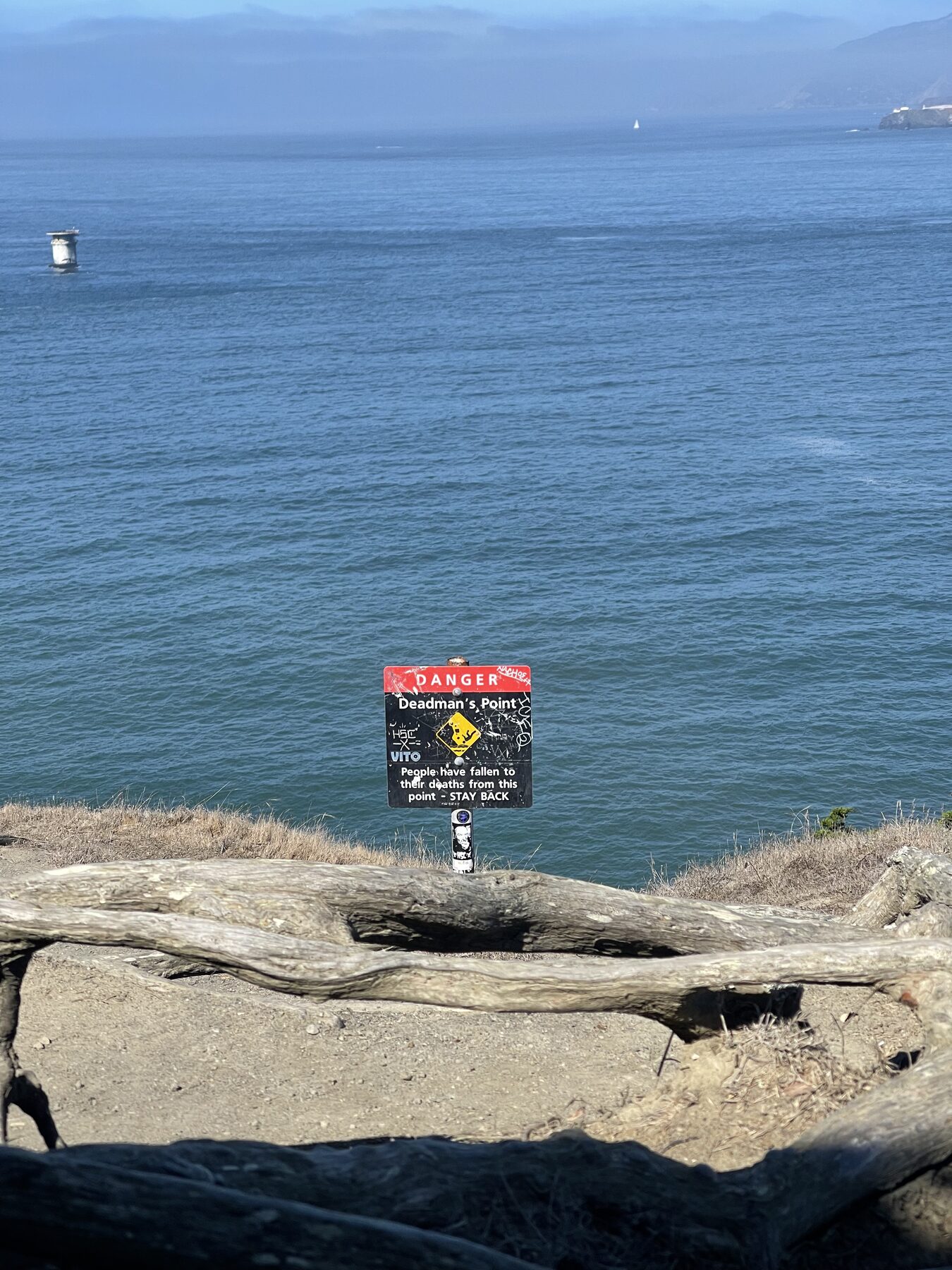 A warning sign above the water.