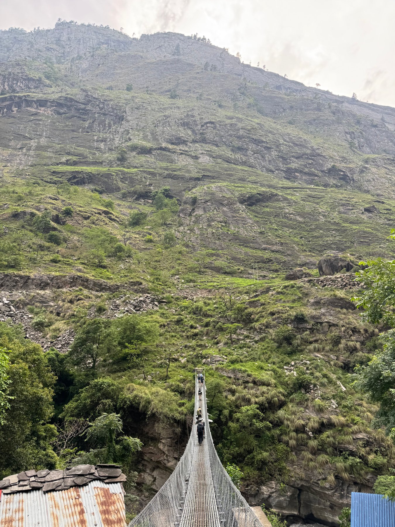 A suspension bridge stretching across the gorge.