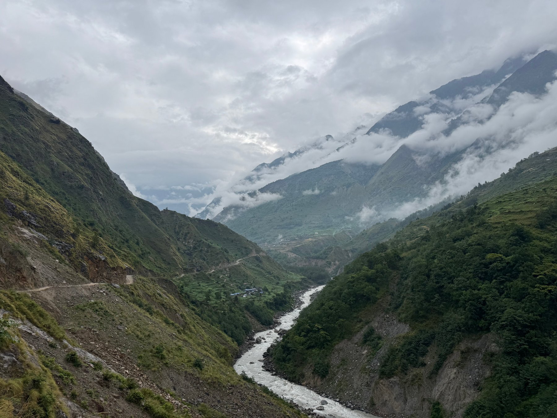 The river winding through a cloudy valley.