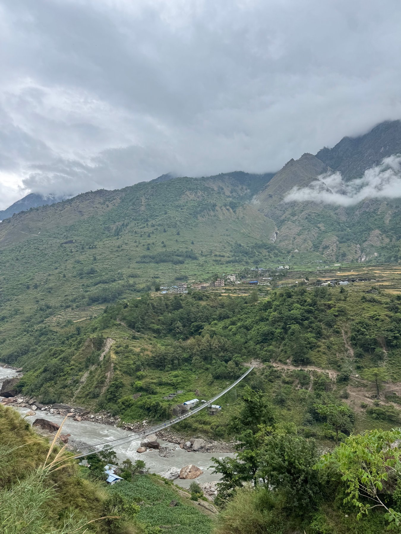Green hills above the river.