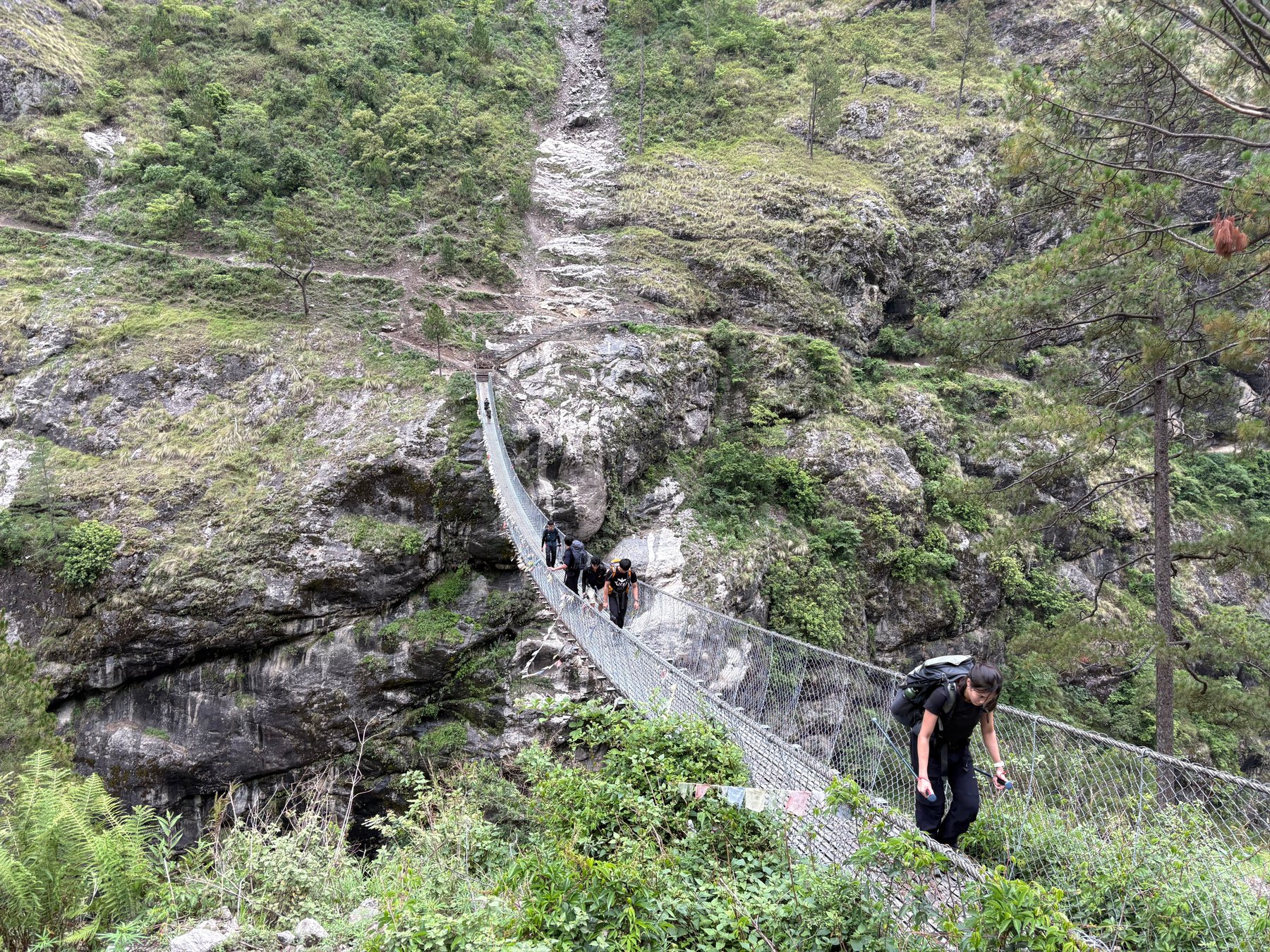 Crossing a suspension bridge.