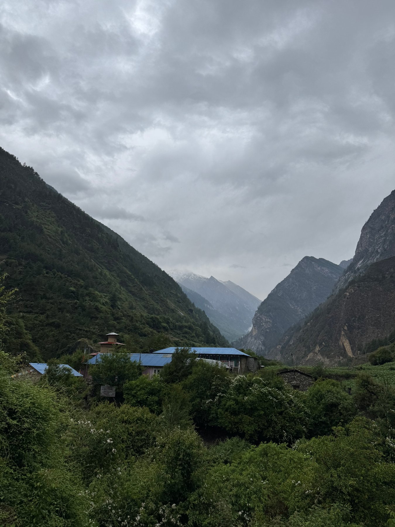 Village rooftops beneath the hills.