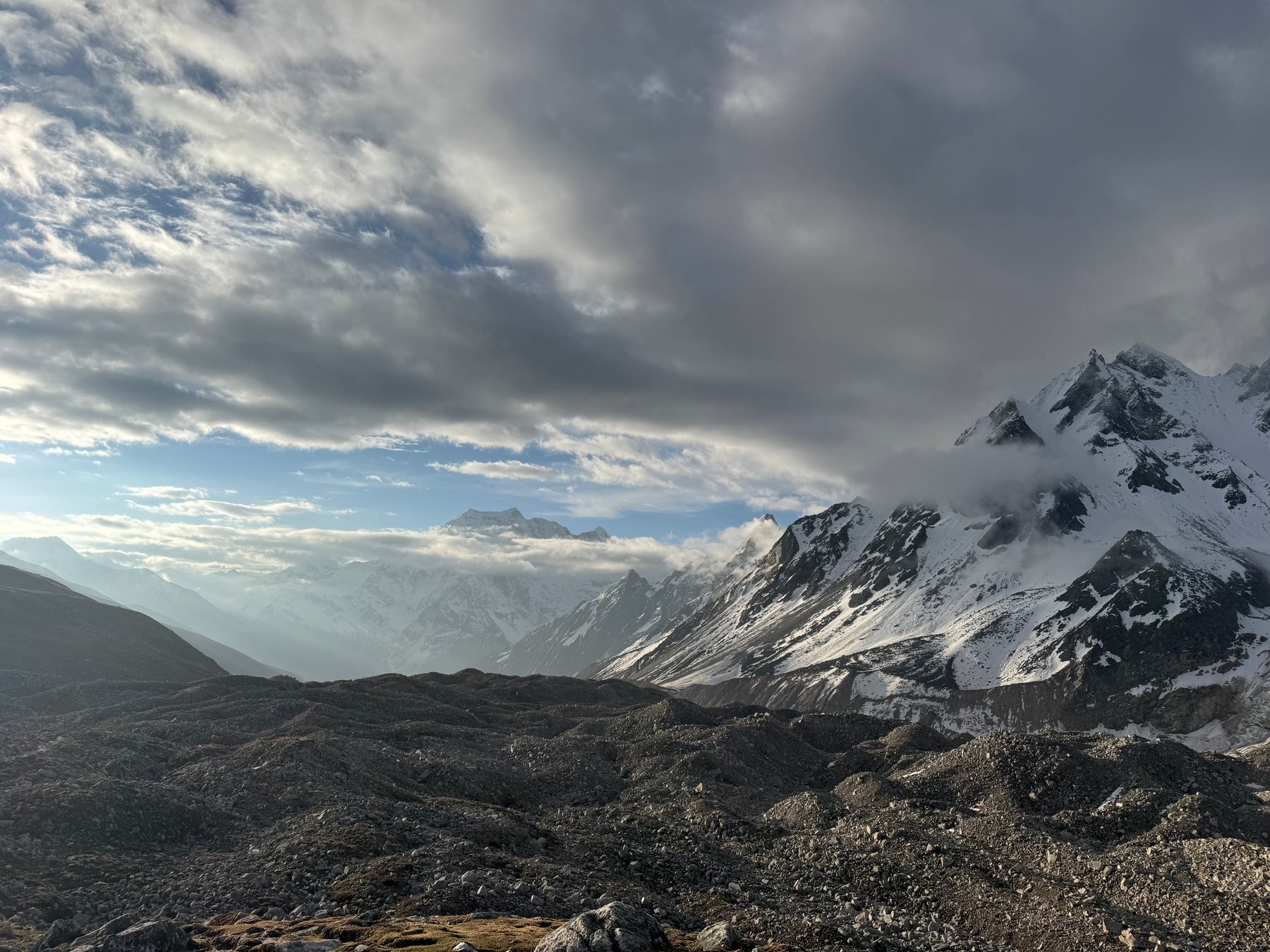 Clouds lifting above the snowy valley.